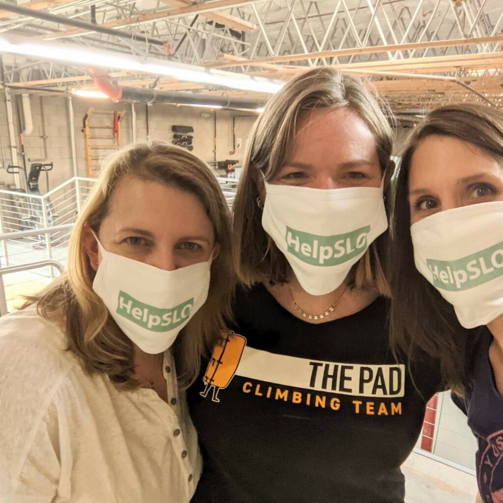 Three women wear HELPSLO masks